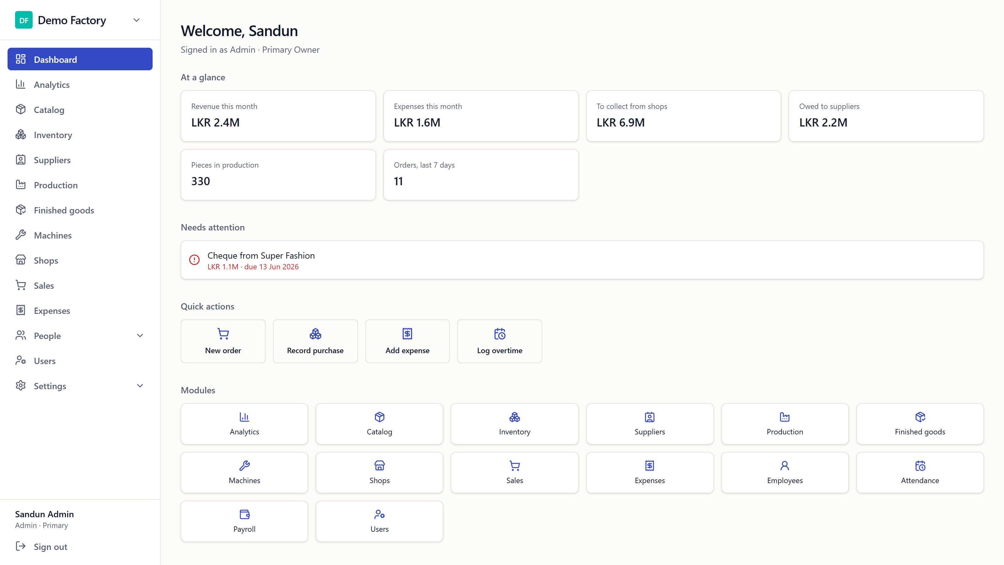 StitchMatrix dashboard showing revenue, expenses, production, and orders for a garment factory on desktop